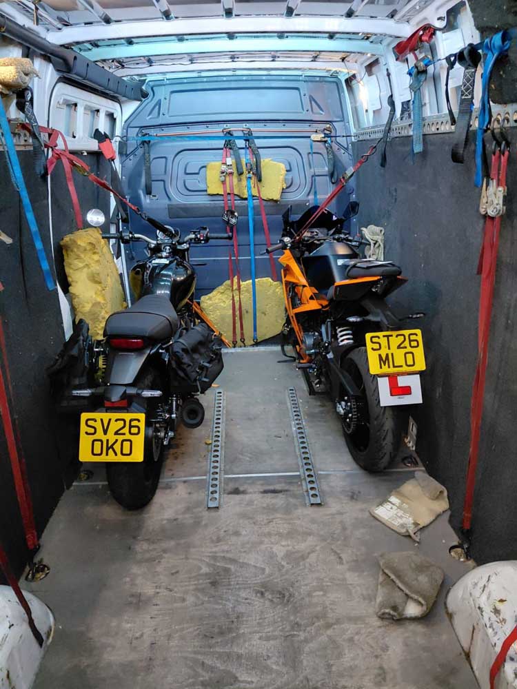 motorcycle transport two bikes ready to go - secured in the van
